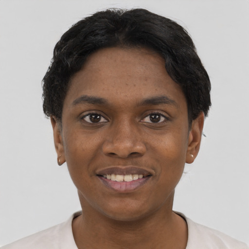 Joyful black young-adult female with short  black hair and brown eyes