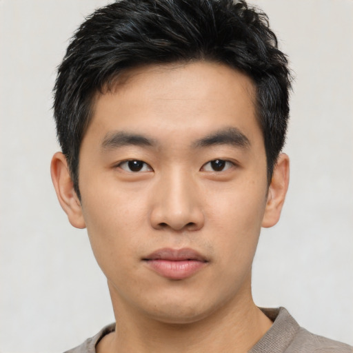 Neutral asian young-adult male with short  black hair and brown eyes