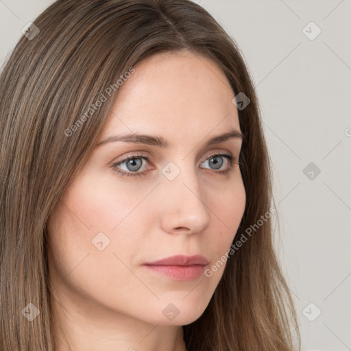 Neutral white young-adult female with long  brown hair and grey eyes