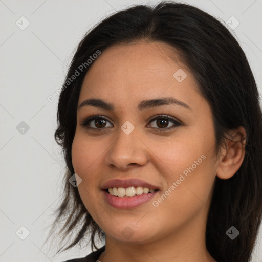 Joyful latino young-adult female with long  brown hair and brown eyes