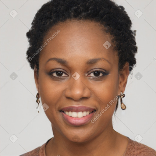 Joyful black young-adult female with short  brown hair and brown eyes