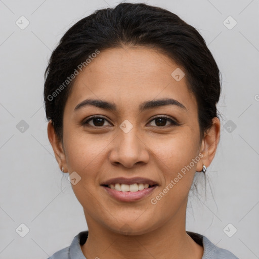 Joyful latino young-adult female with short  brown hair and brown eyes