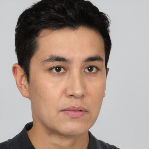 Neutral white young-adult male with short  black hair and brown eyes