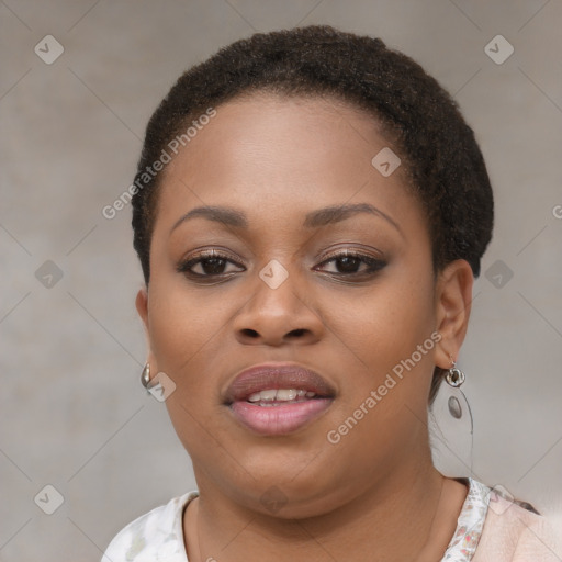 Joyful black young-adult female with short  brown hair and brown eyes