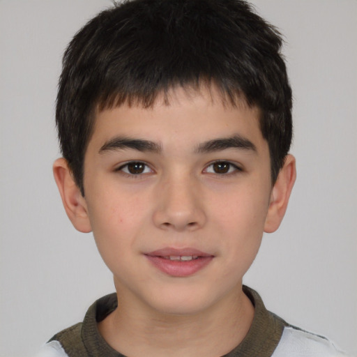 Joyful white child male with short  brown hair and brown eyes