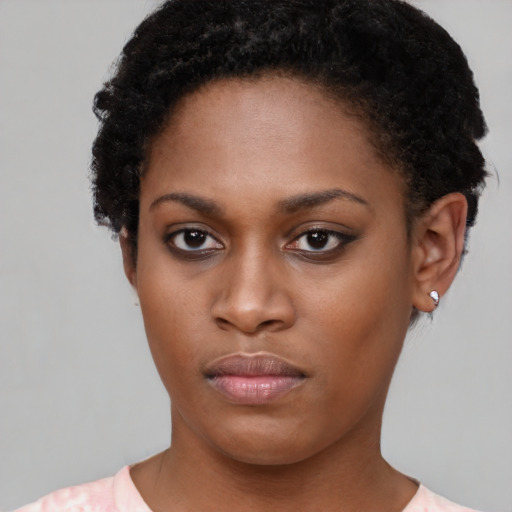 Neutral black young-adult female with short  brown hair and brown eyes