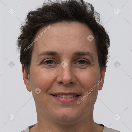 Joyful white adult female with short  brown hair and brown eyes