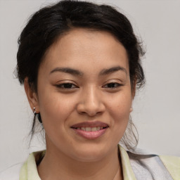 Joyful asian young-adult female with medium  brown hair and brown eyes