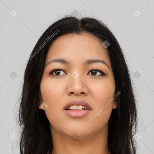 Joyful asian young-adult female with long  brown hair and brown eyes