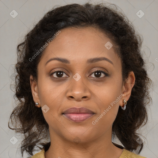 Joyful latino adult female with medium  brown hair and brown eyes