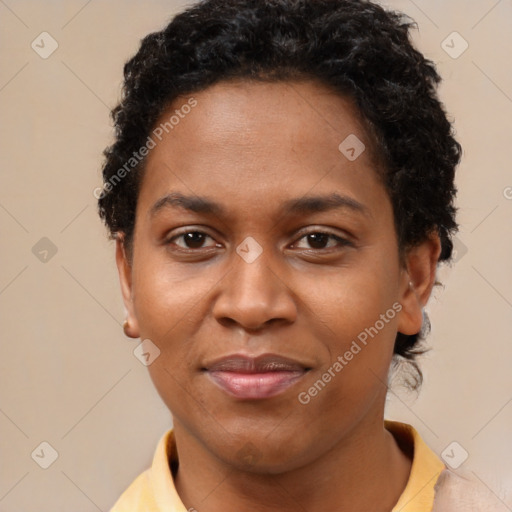 Joyful black young-adult female with short  brown hair and brown eyes