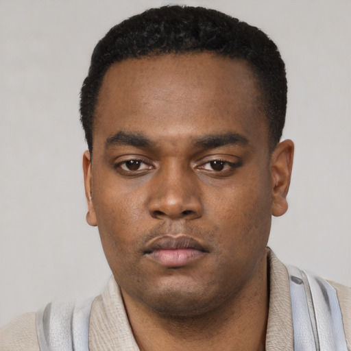Neutral black young-adult male with short  black hair and brown eyes