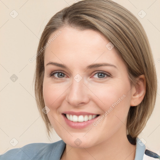 Joyful white young-adult female with medium  brown hair and blue eyes