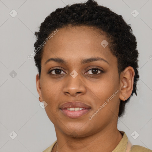 Joyful black young-adult female with short  brown hair and brown eyes