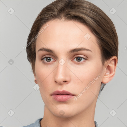 Neutral white young-adult female with medium  brown hair and grey eyes