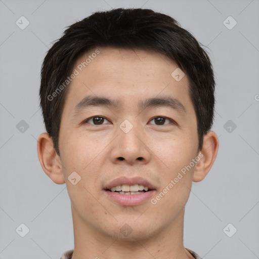 Joyful asian young-adult male with short  brown hair and brown eyes