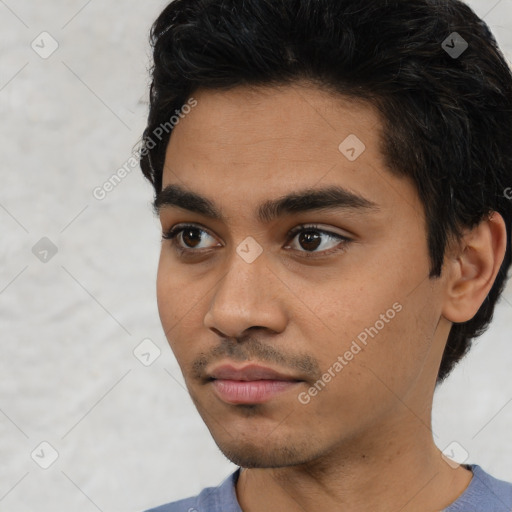 Neutral white young-adult male with short  black hair and brown eyes