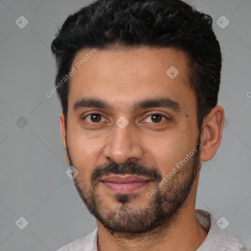 Joyful latino young-adult male with short  black hair and brown eyes