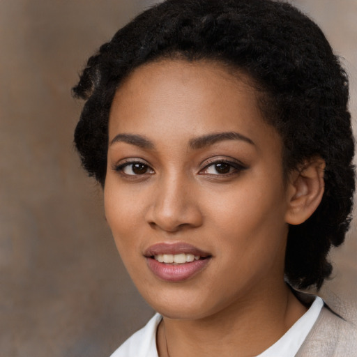 Joyful latino young-adult female with short  black hair and brown eyes