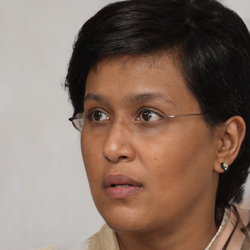 Neutral black young-adult female with short  brown hair and brown eyes