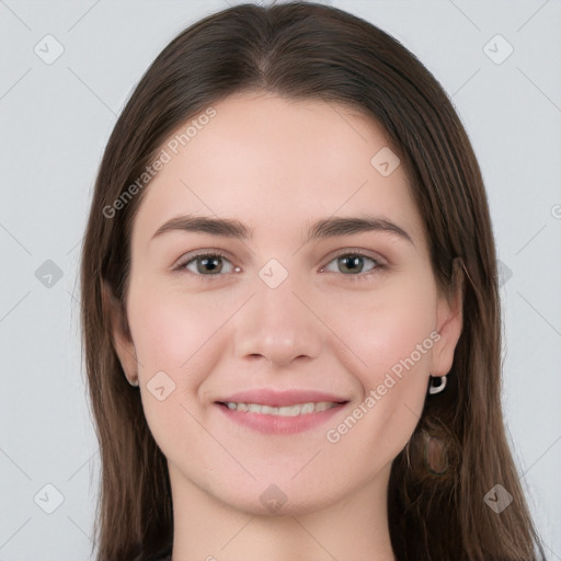 Joyful white young-adult female with long  brown hair and grey eyes