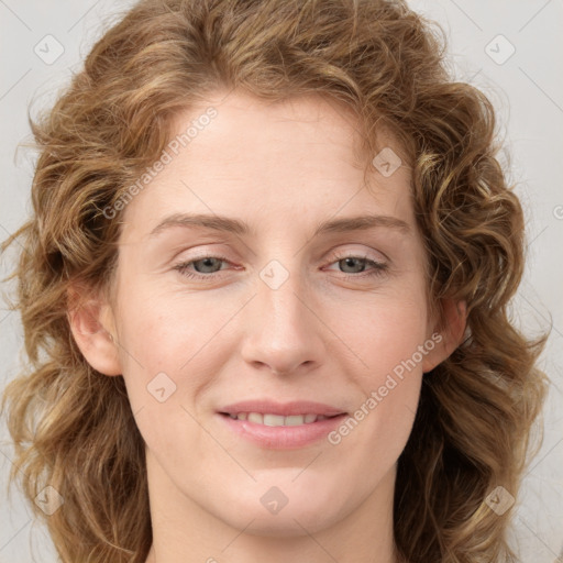 Joyful white young-adult female with medium  brown hair and blue eyes