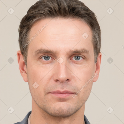 Neutral white adult male with short  brown hair and grey eyes