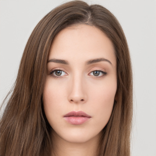 Neutral white young-adult female with long  brown hair and brown eyes