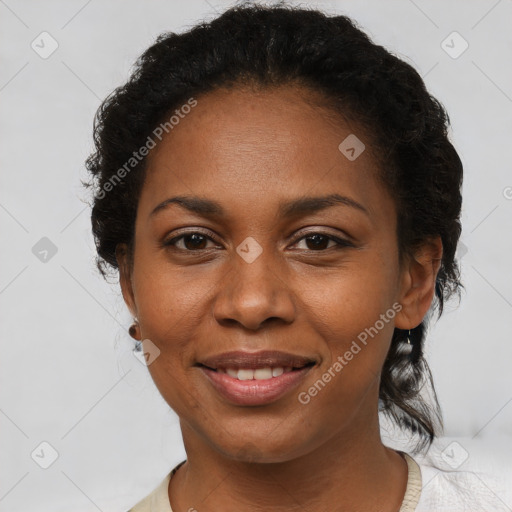 Joyful black adult female with short  brown hair and brown eyes