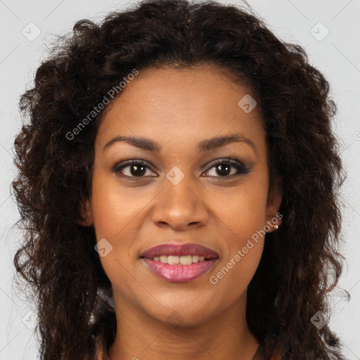 Joyful black young-adult female with long  brown hair and brown eyes