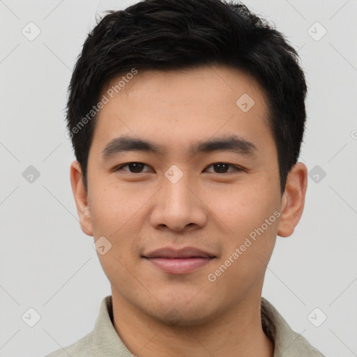 Joyful asian young-adult male with short  black hair and brown eyes