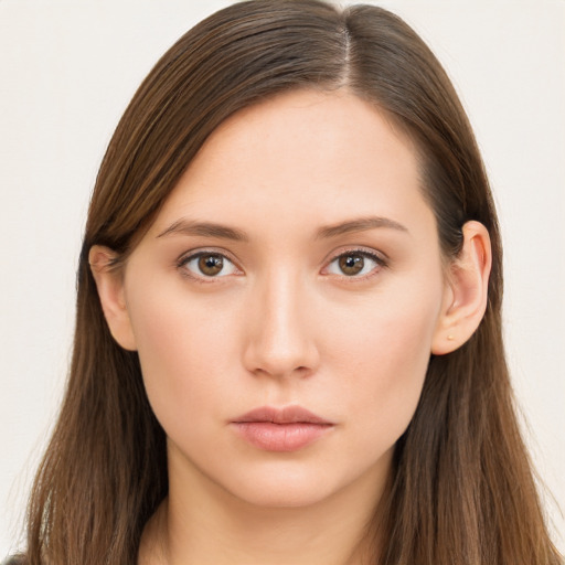 Neutral white young-adult female with long  brown hair and brown eyes