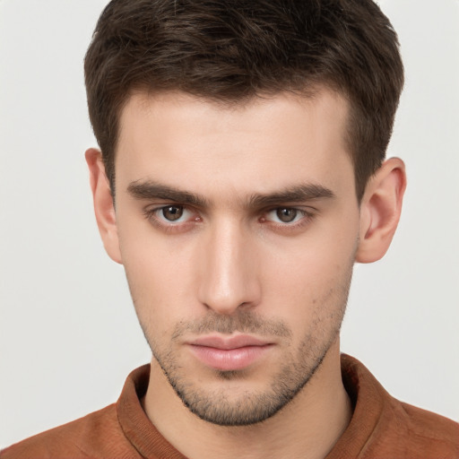 Neutral white young-adult male with short  brown hair and brown eyes