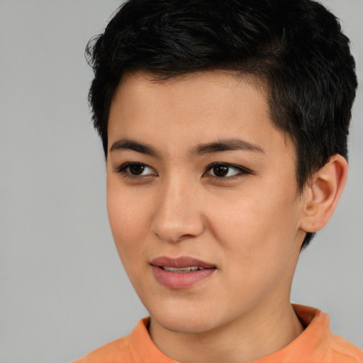 Joyful asian young-adult female with short  brown hair and brown eyes