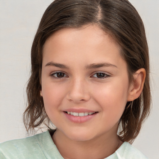 Joyful white child female with medium  brown hair and brown eyes