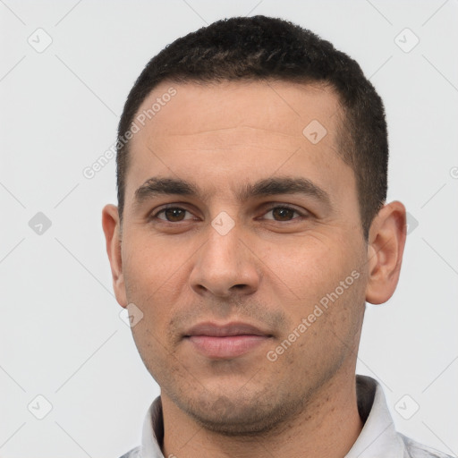 Joyful white young-adult male with short  black hair and brown eyes