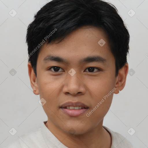 Joyful asian young-adult male with short  black hair and brown eyes