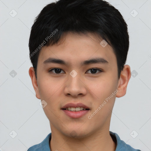 Joyful asian young-adult male with short  black hair and brown eyes