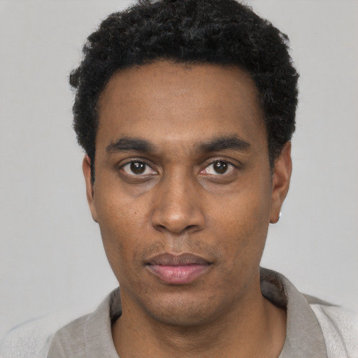 Neutral black young-adult male with short  black hair and brown eyes