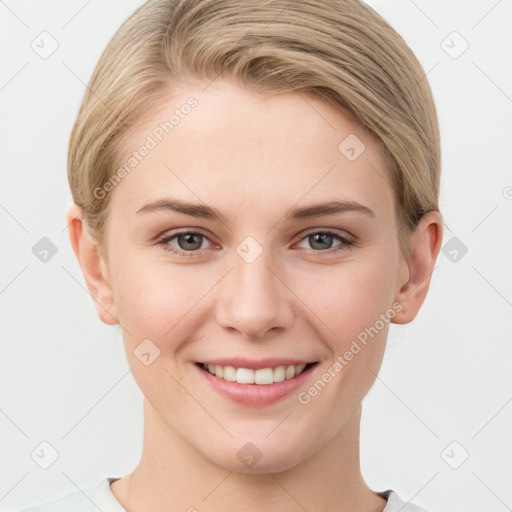 Joyful white young-adult female with short  brown hair and grey eyes