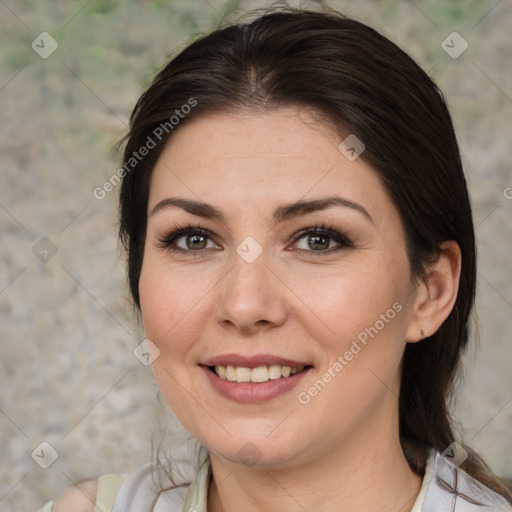 Joyful white adult female with medium  brown hair and brown eyes