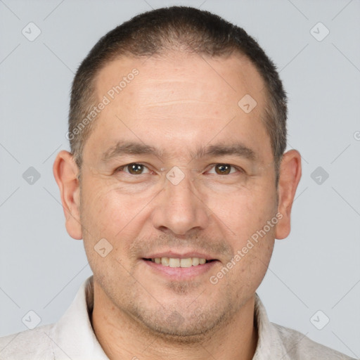 Joyful white adult male with short  brown hair and brown eyes