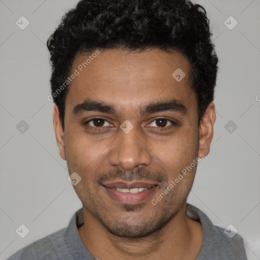 Joyful black young-adult male with short  black hair and brown eyes