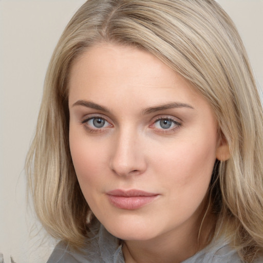 Neutral white young-adult female with long  brown hair and blue eyes