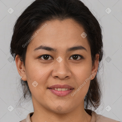 Joyful latino young-adult female with medium  brown hair and brown eyes