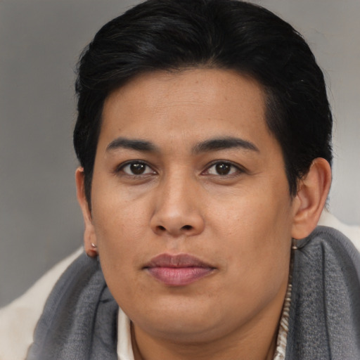 Joyful asian young-adult female with short  brown hair and brown eyes