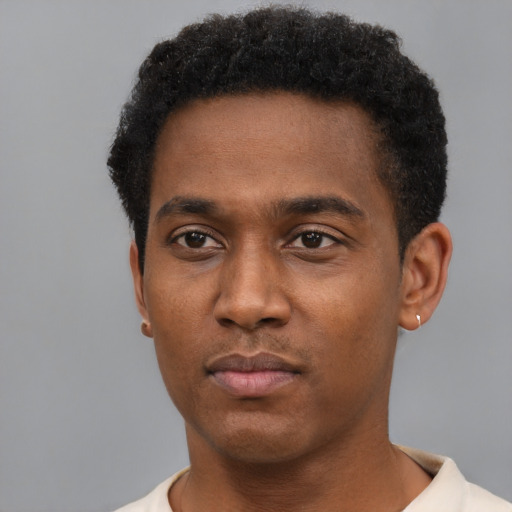 Neutral black young-adult male with short  black hair and brown eyes