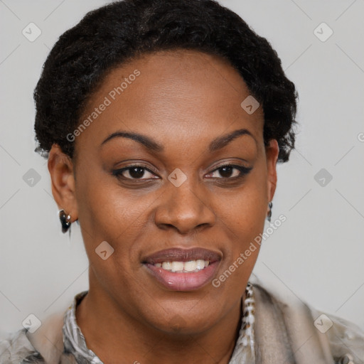 Joyful black adult female with short  brown hair and brown eyes