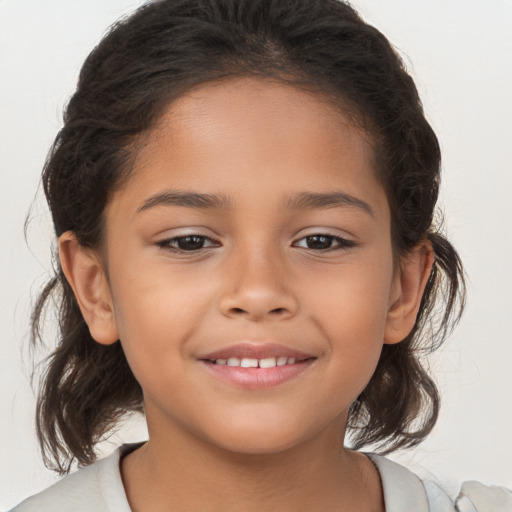 Joyful white child female with medium  brown hair and brown eyes