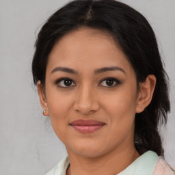 Joyful asian young-adult female with medium  brown hair and brown eyes